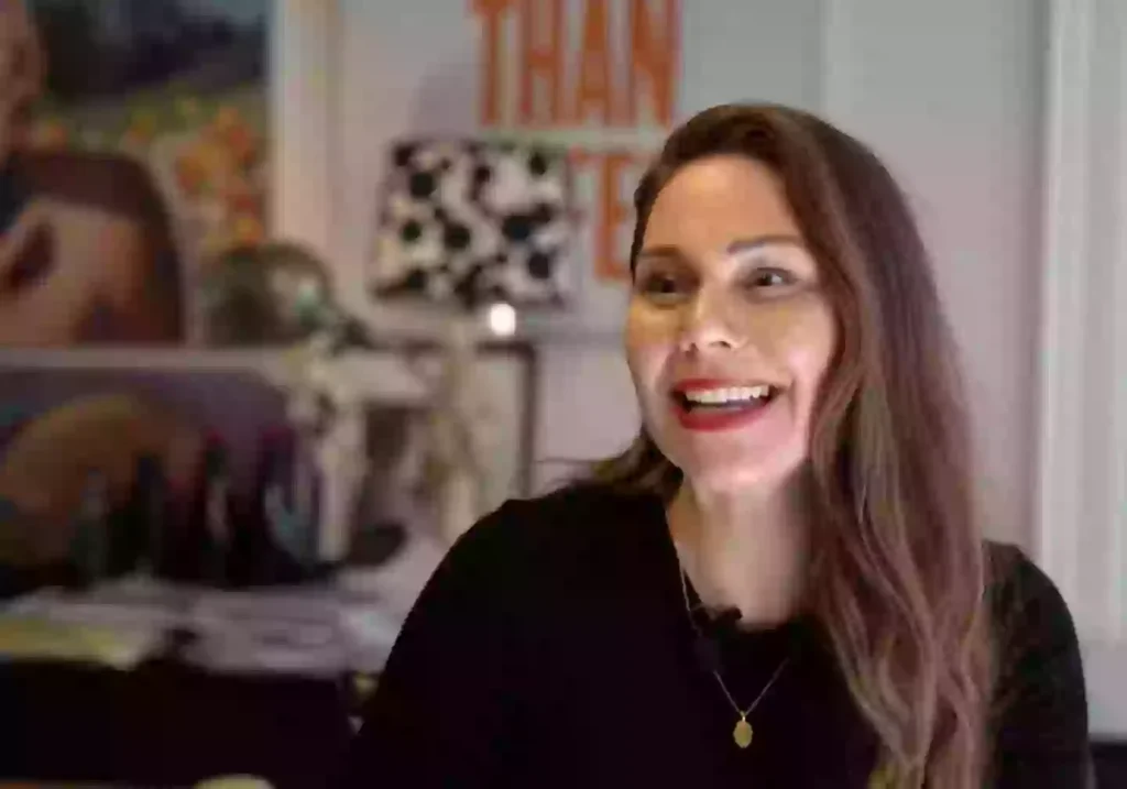 CEO Erika Lust in a modern office environment, embodying progressive workplace wellness practices.